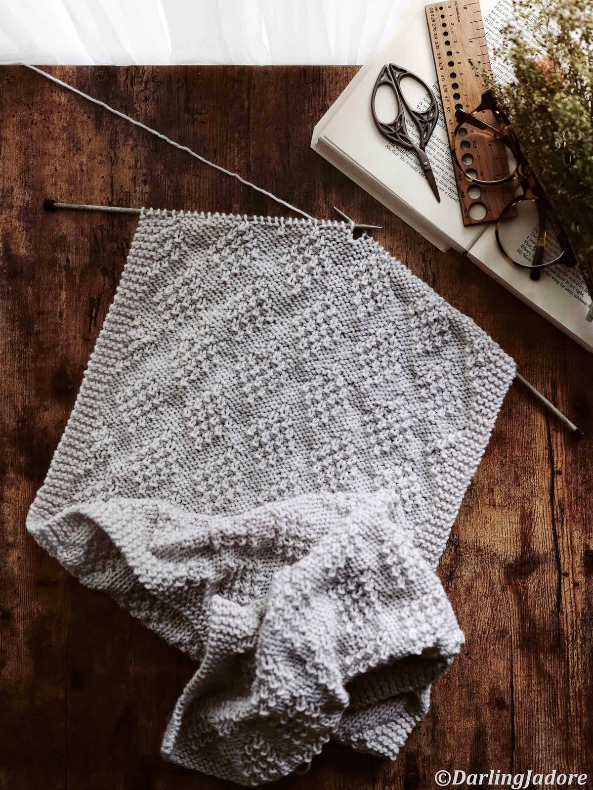 Close-up of diamond textured knit scarf pattern showing beautiful stitch detail
