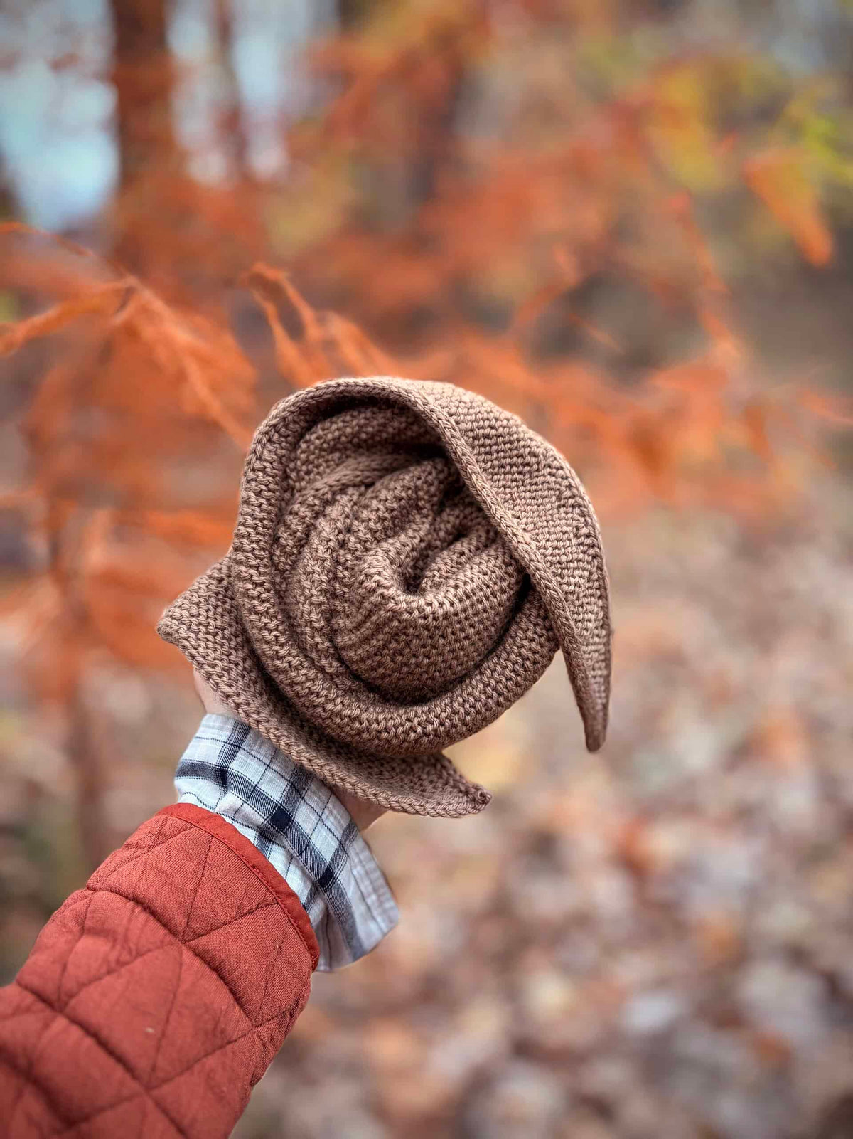 The Skysong Scarf knitting pattern showing sweeping asymmetrical silhouette and plush texture