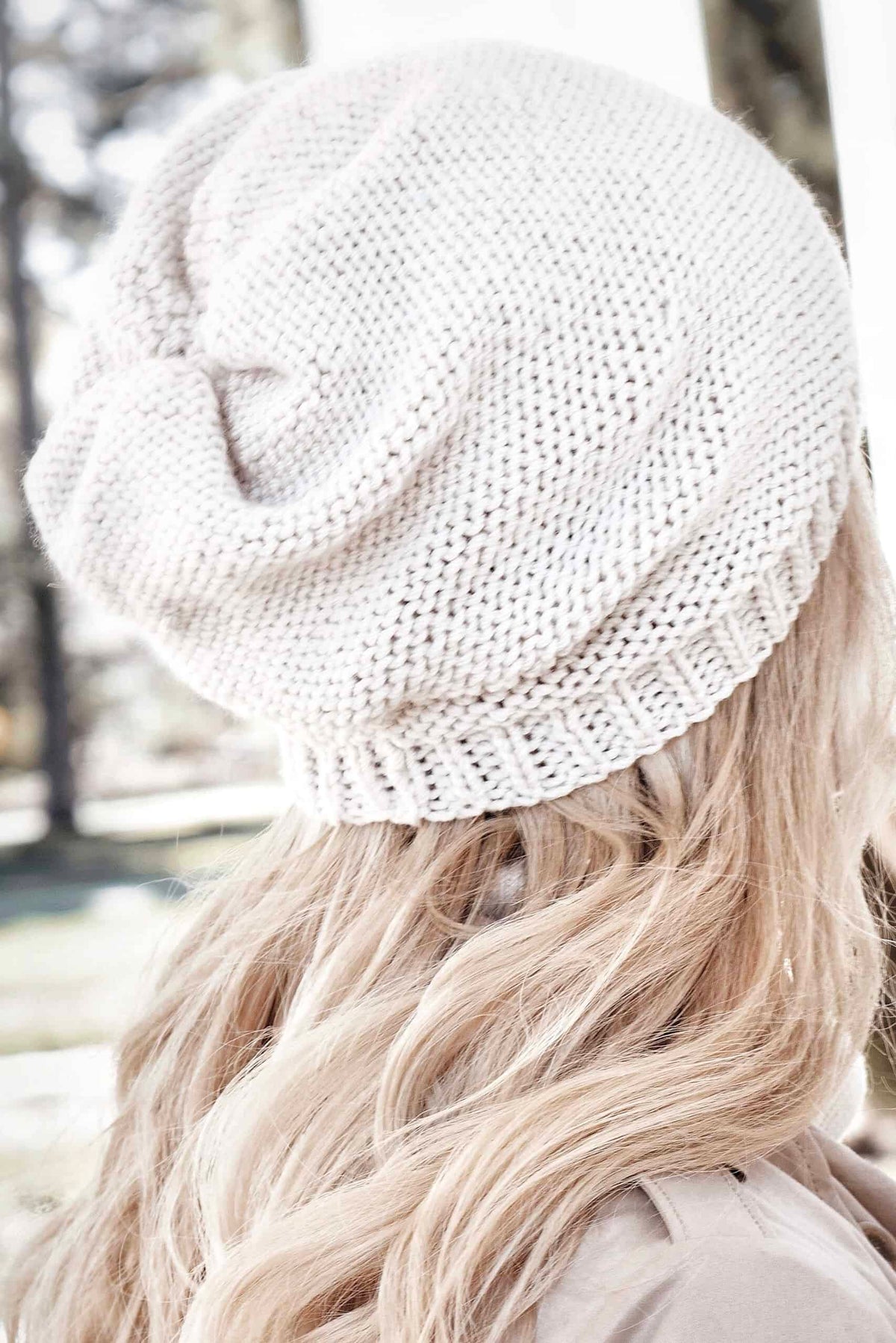 Close-up of slouchy beanie showing beautiful knit stitch texture and elegant drape - beginner-friendly hat pattern