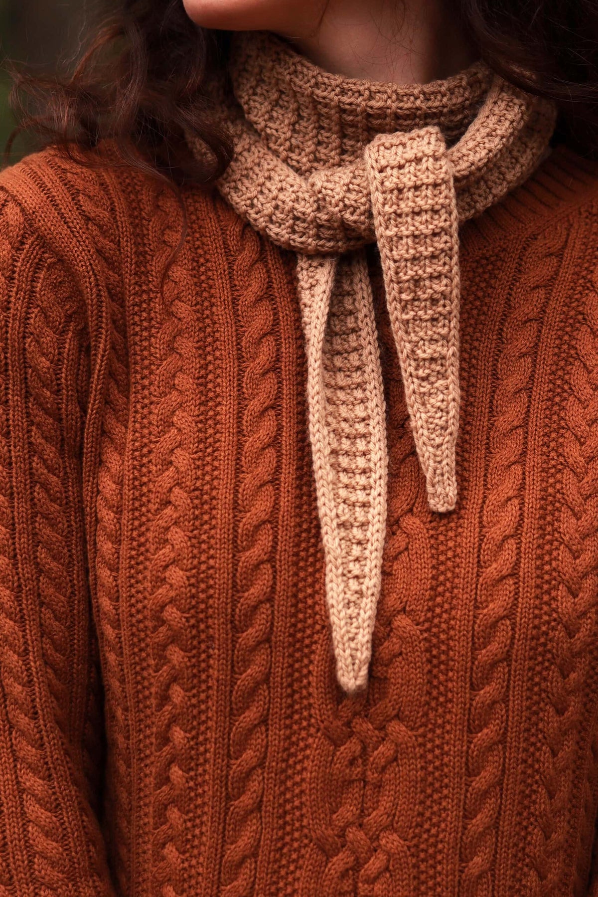 Small scarf knitting pattern detail showing textured stitch work and refined edges