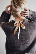 Elegant cream raglan sweater with keyhole back and ribbon detail from Posy knitting pattern