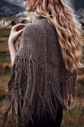 Beige crescent shawl with tassels draped elegantly - beginner lace shawl knitting pattern by Darling Jadore