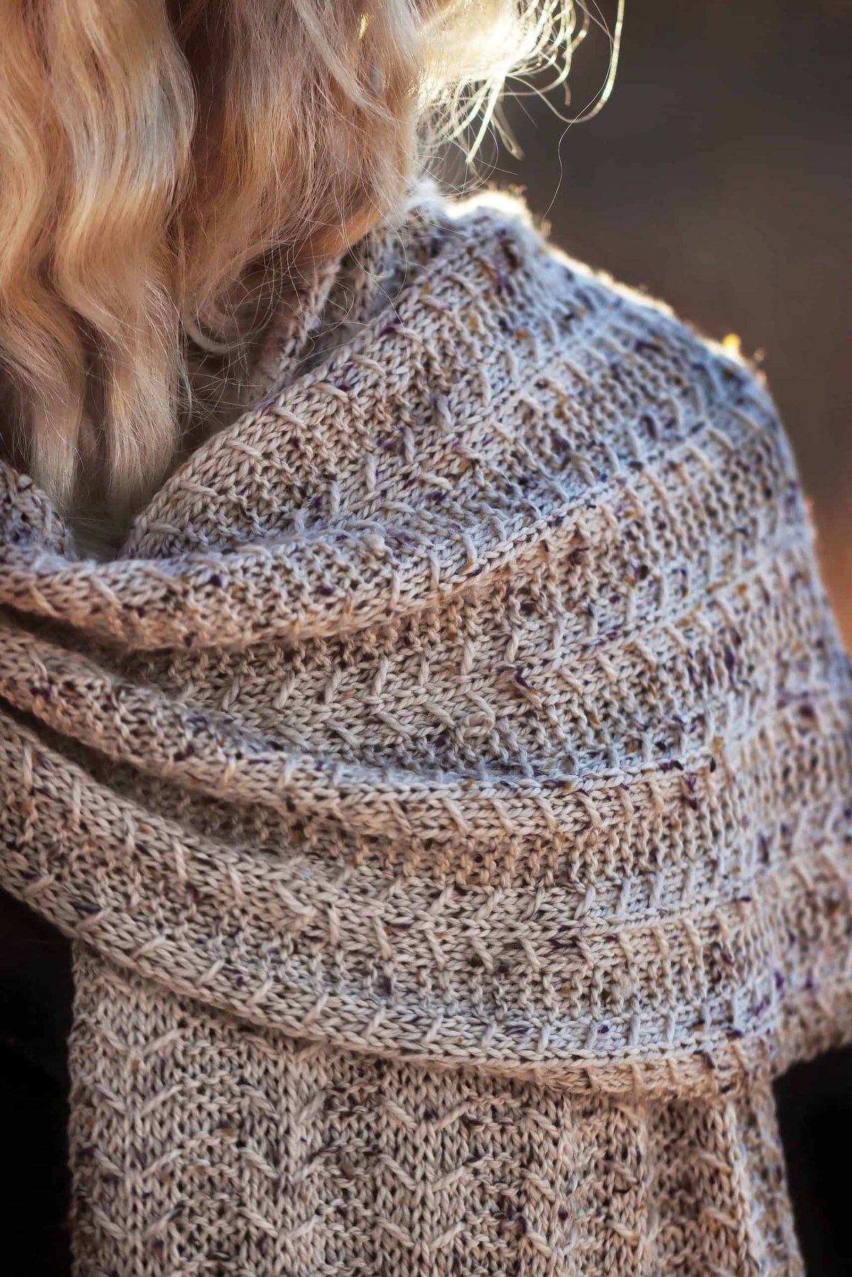 Close up of Breck scarf knitting pattern showcasing luxurious textured geometric stitches
