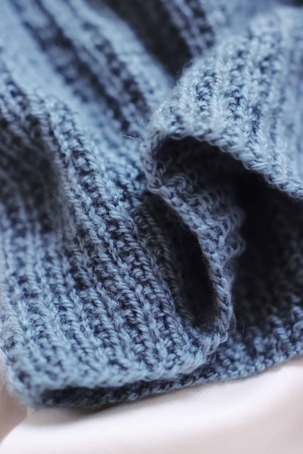 Detailed view of textured camisole knitting pattern showing delicate stitch work