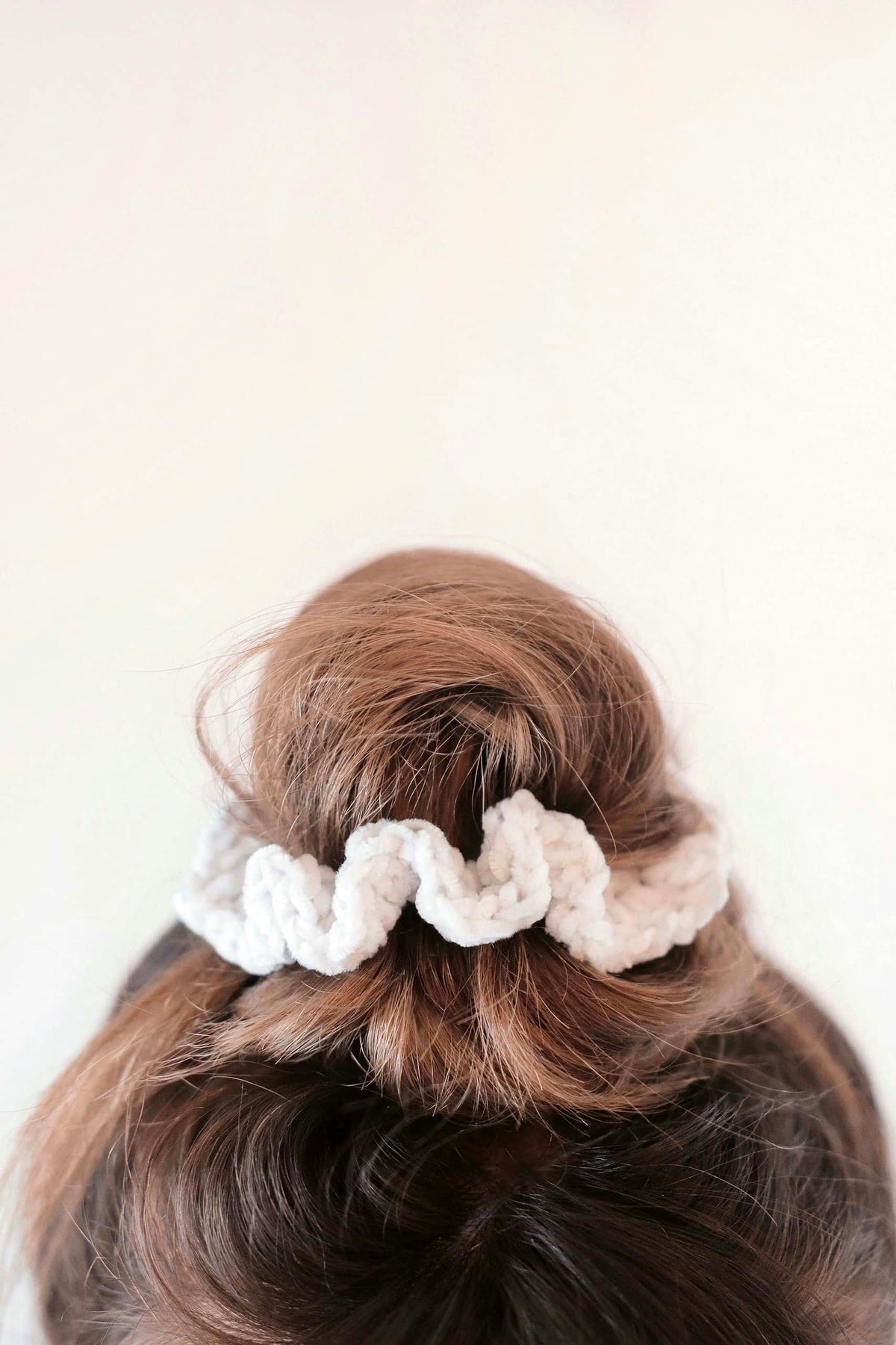 Handmade velvet crochet scrunchie in neutral tones with classic design