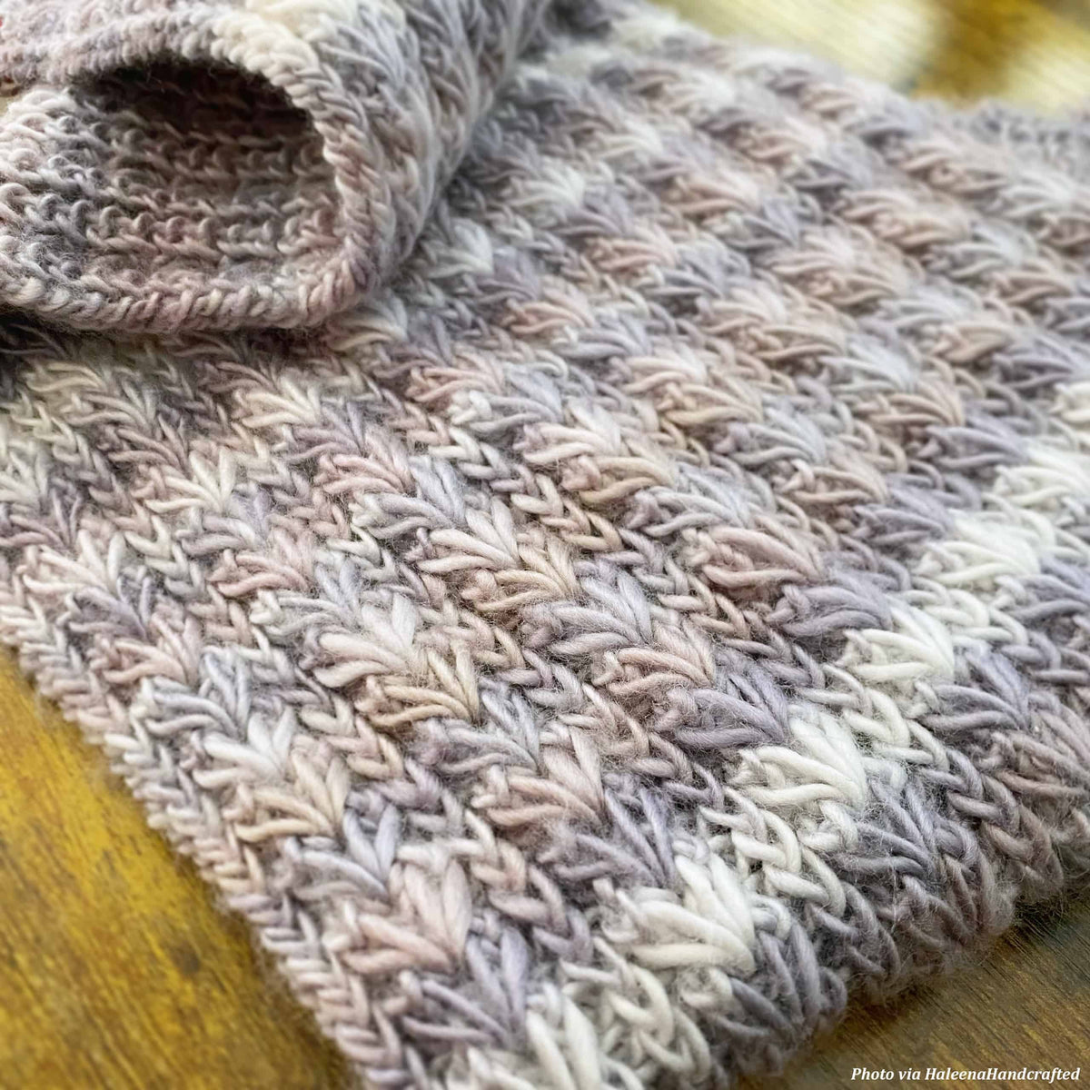Chunky knit scarf pattern with captivating textured stitches and sophisticated design