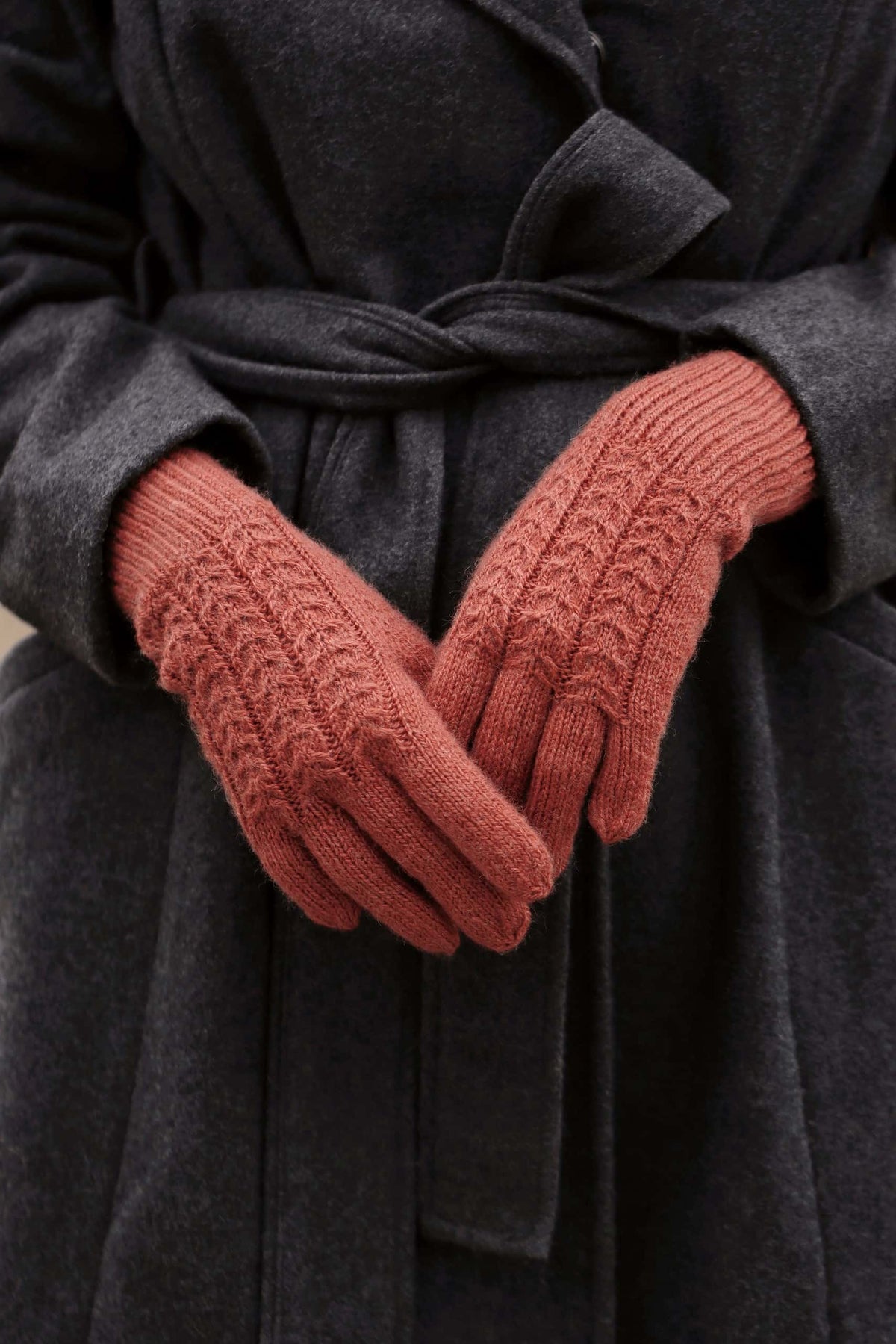 Women wearing cable knit gloves pattern showing elegant fit and cable texture