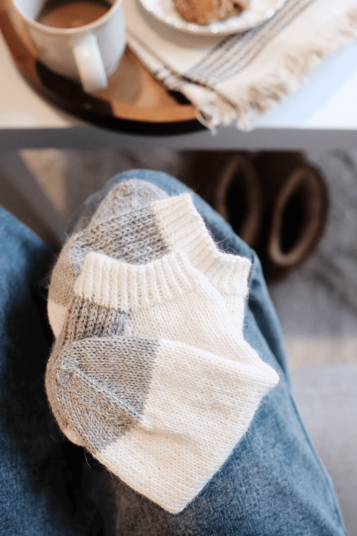 Women wearing handknit ankle socks in retro grey and white design