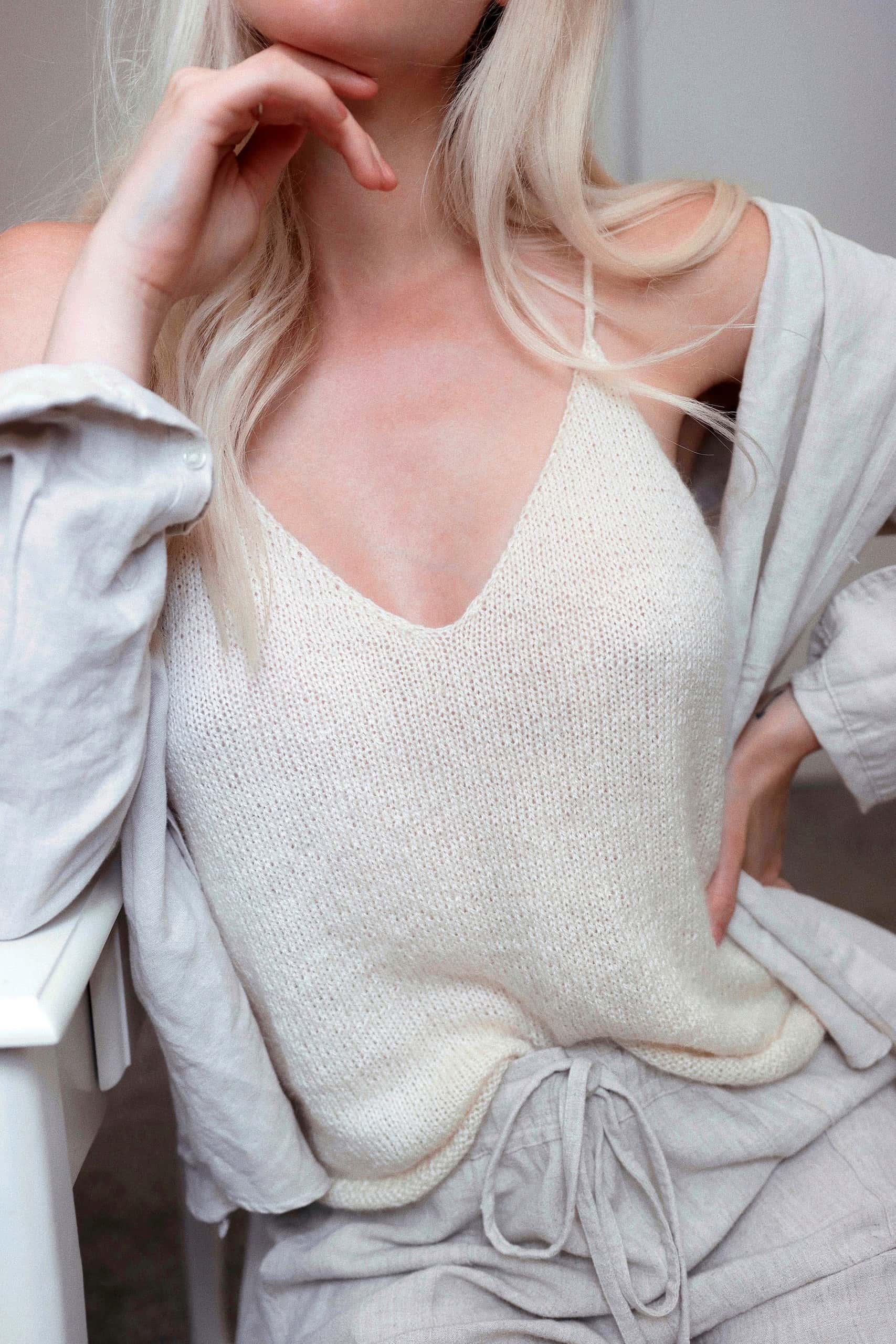 Knitted camisole tank top in cream yarn with ribbed hem and adjustable straps - DIY knit singlet pattern by Darling Jadore