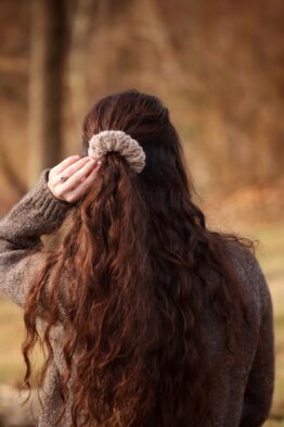 Delicate lace scrunchie knitting pattern with romantic gathered silhouette in cream sock yarn